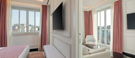 Superior Suite | Living area | 34-inch plasma TV with cable channels