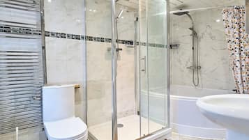 Separate tub and shower, deep soaking tub, towels
