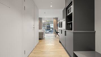 Studio, meerdere bedden, kitchenette, uitzicht op stad | Interieur