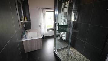 Shower, hair dryer, towels, soap