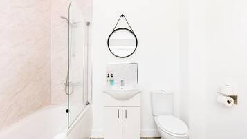 Shower, hair dryer, towels, shampoo