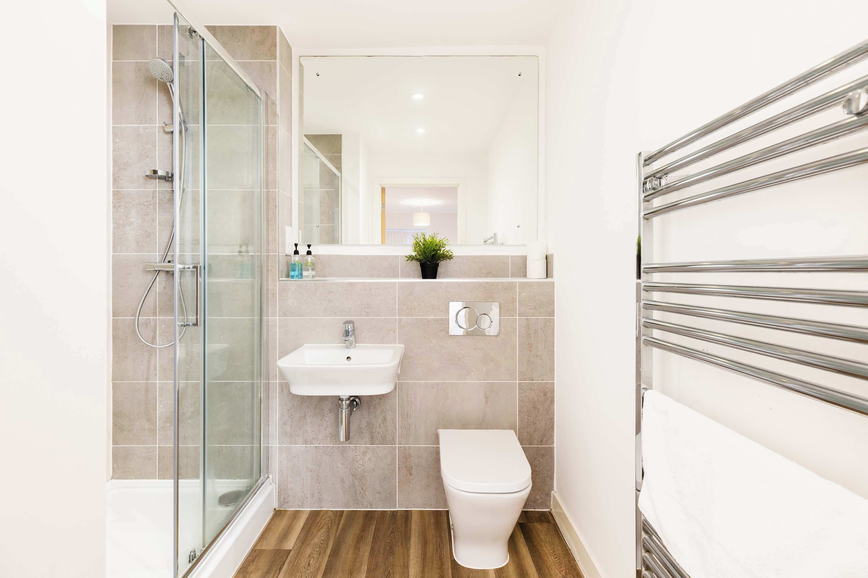 Shower, hair dryer, towels, shampoo