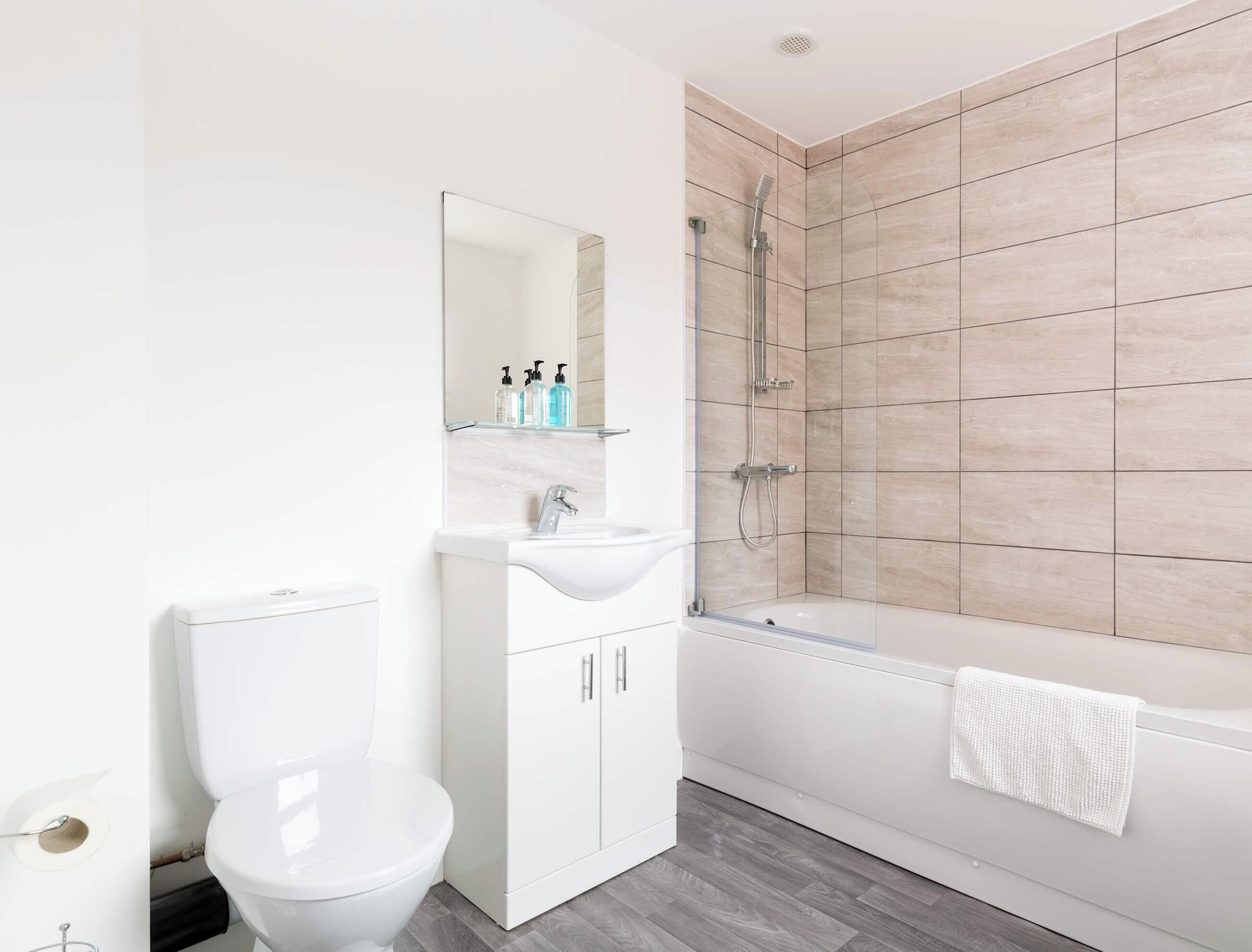 Shower, hair dryer, towels, shampoo
