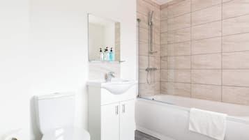 Shower, hair dryer, towels, shampoo