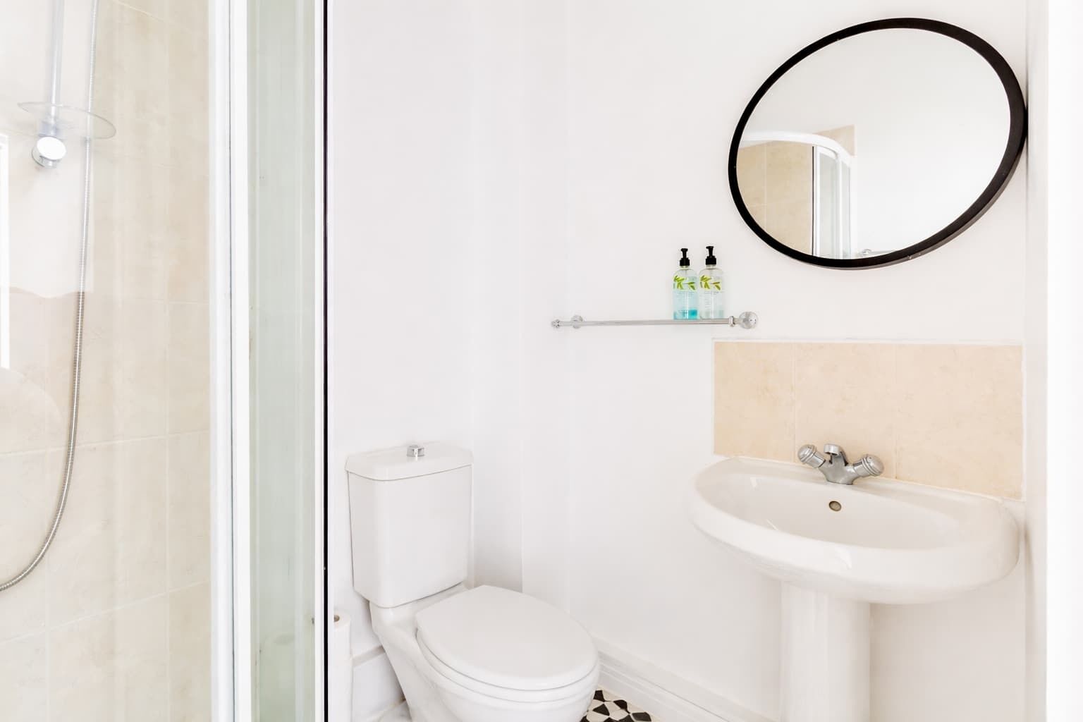 Shower, hair dryer, towels, shampoo