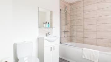 Shower, hair dryer, towels, shampoo