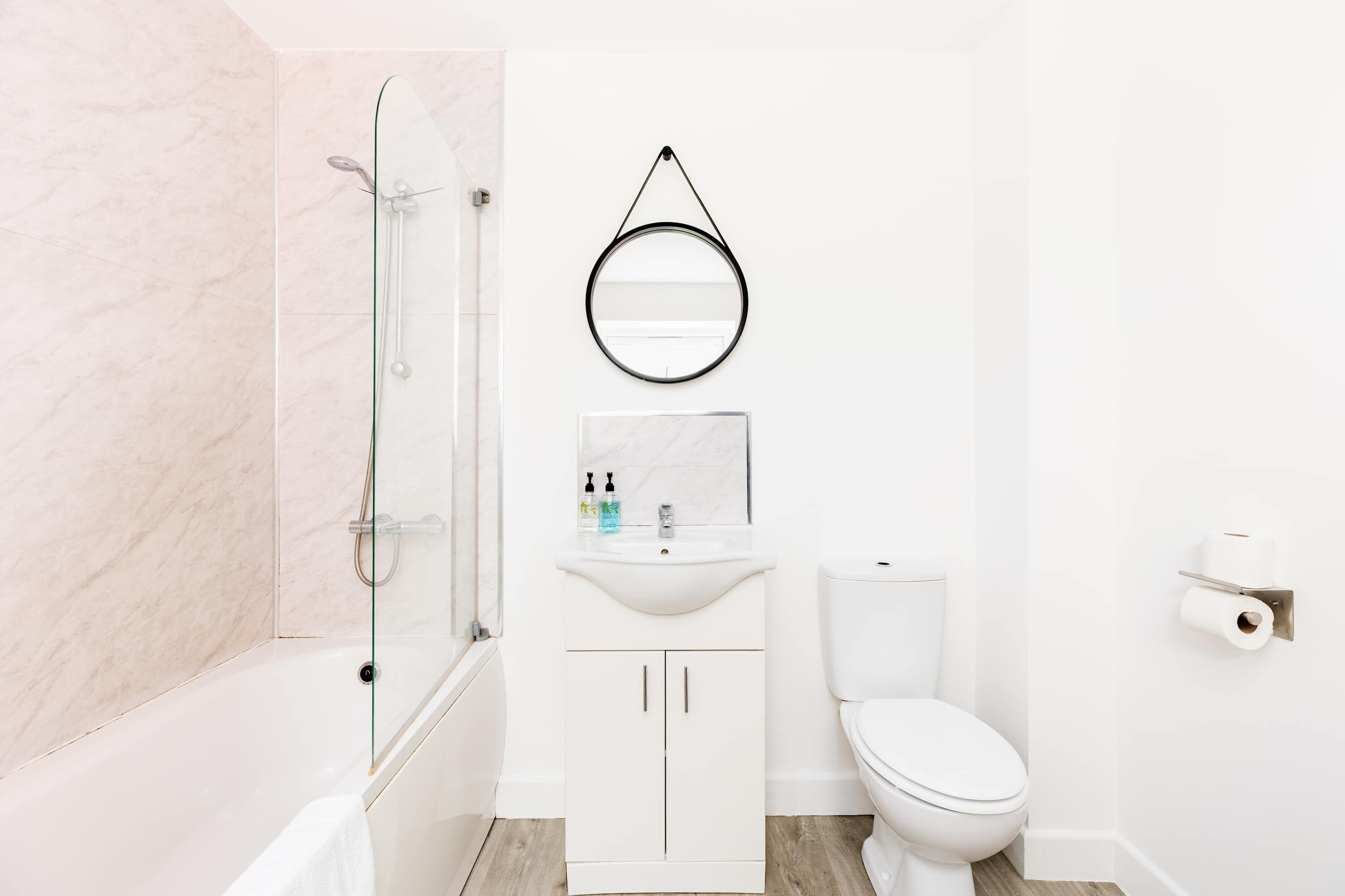 Shower, hair dryer, towels, shampoo