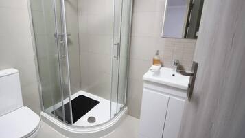 Shower, hair dryer, towels, shampoo