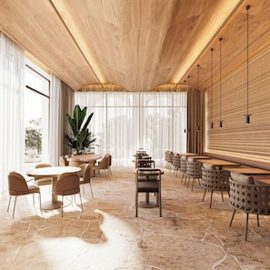 A modern interior with wooden ceiling, large windows, and a stone floor. - Hotel Camelot By Artur (Ksamil)