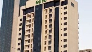 A tall building with the word "elite" on the top. - Elite Residence View Palace Apartment (Nairobi)