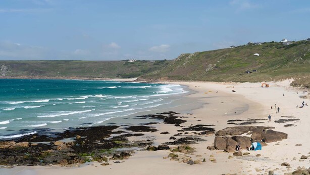 A beach with rocky areas, a sandy shore, and a clear blue sky. - Kitticarn, Panoramic Sea Views, Garden, Parking (Sennen)