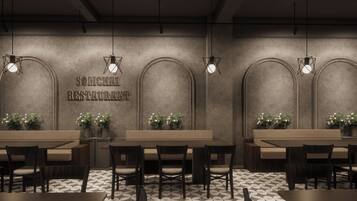 Un interior de restaurante de diseño moderno, con una pared central que muestra el nombre del restaurante, varias zonas de estar con mesas y sillas, y lámparas decorativas.