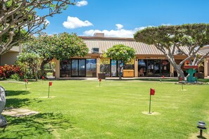 A building with a sign for 'SAND WITCH' and a visible entrance. - Sugar Beach Resort 232, Oceanfront Ocean View, Central A/C (Kihei)