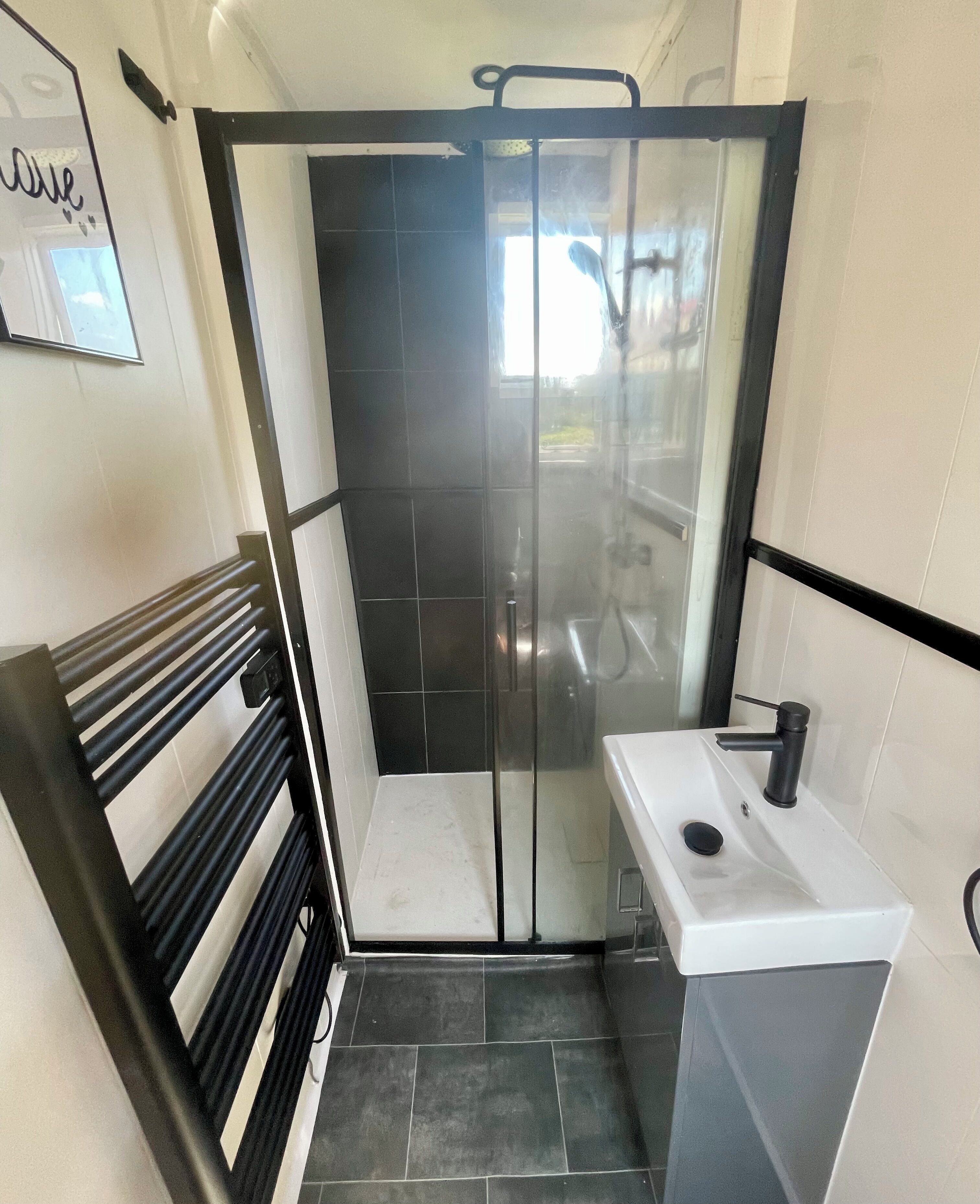 Shower, towels, soap, toilet paper