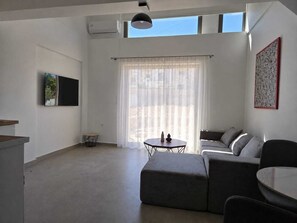 Deluxe appartement, uitzicht op tuin | Woonruimte
