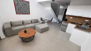 Deluxe appartement, uitzicht op tuin | Woonruimte