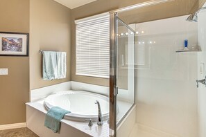 A bathroom with a glass-enclosed shower, a white bathtub, and a sink. - Near Zion! Extended Desert Retreat w/ Pool Access (Washington)