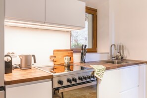 Private kitchen - Panoramic Views in the Heart of Tuscany, Historic Borgo Apartment with balcony. (Scrofiano)