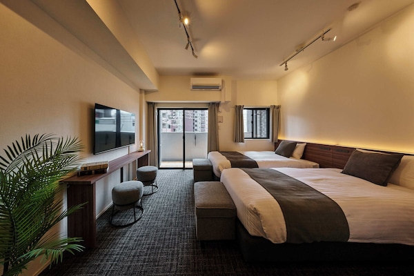 Twin Room | Blackout drapes, iron/ironing board, WiFi (free), bed sheets