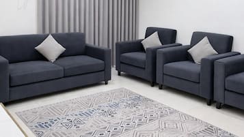 Deluxe Apartment, 2 Bedrooms, Non Smoking, Kitchenette | Living area | 32-inch flat-screen TV with satellite channels