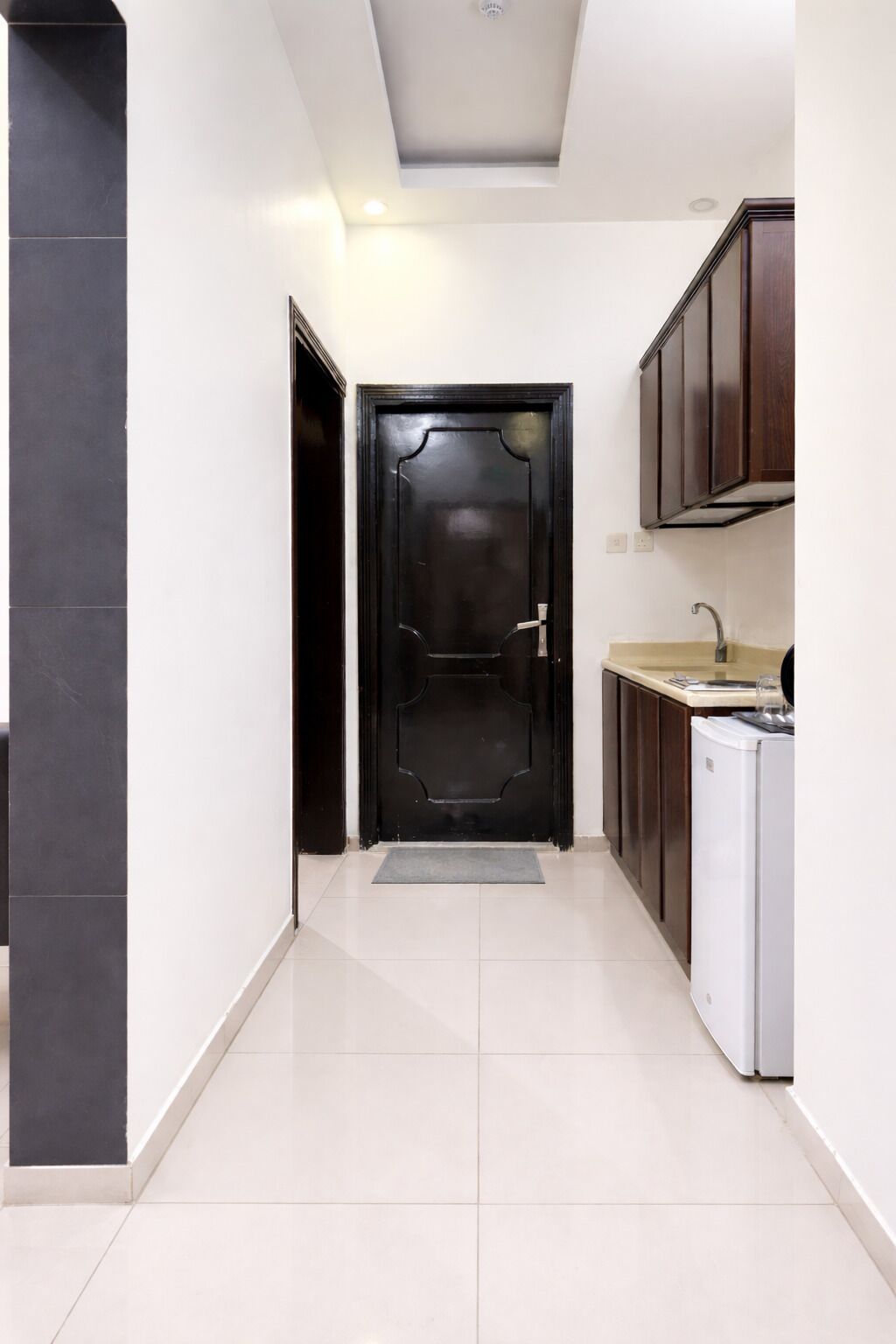 Mini-fridge, stovetop, electric kettle, cookware/dishes/utensils