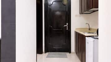 Mini-fridge, stovetop, electric kettle, cookware/dishes/utensils
