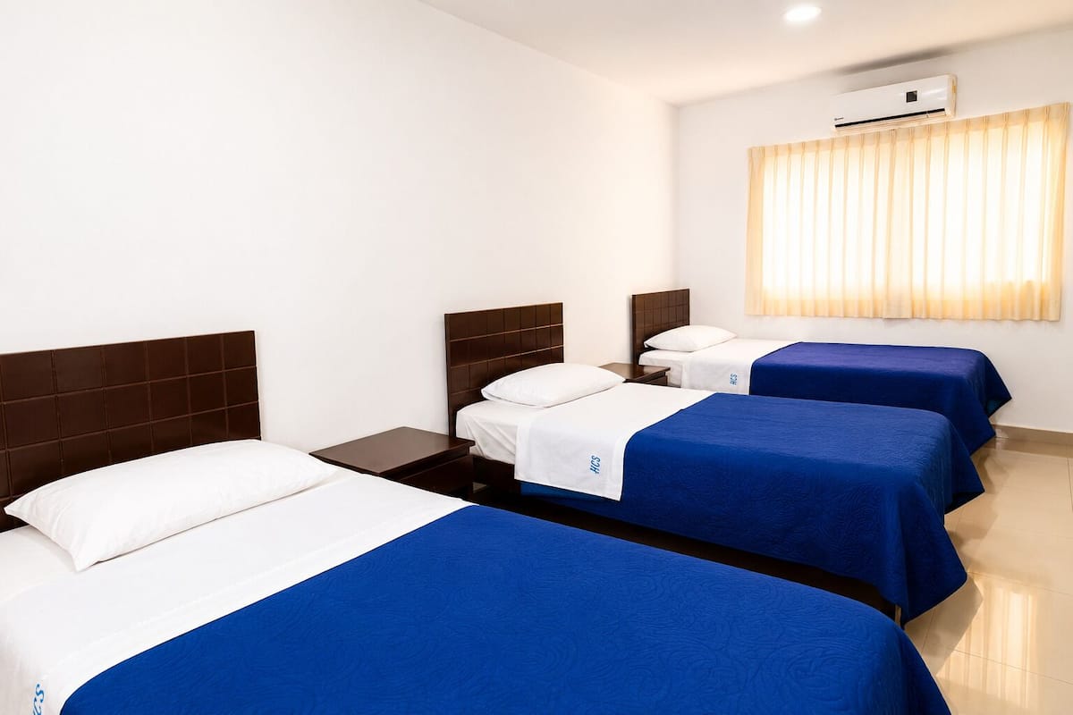 Standard Triple Room | Desk, laptop workspace, WiFi (free), bed sheets