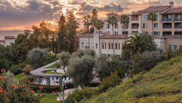 A resort with multiple-story buildings, a landscaped garden, and a pool area. - 2-bedroom condo at the incredible Marriott Newport Coast Villas Resort (Newport Beach)