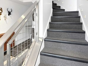 A modern staircase with a metal railing and carpeted steps. - Lovebirds paradise by Main Street (Park City)