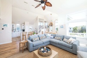 A spacious living room with a large sectional sofa, a coffee table, and a ceiling fan. - Newly Renovated: Pool/Spa, GameRm, Community Perks (Corolla)