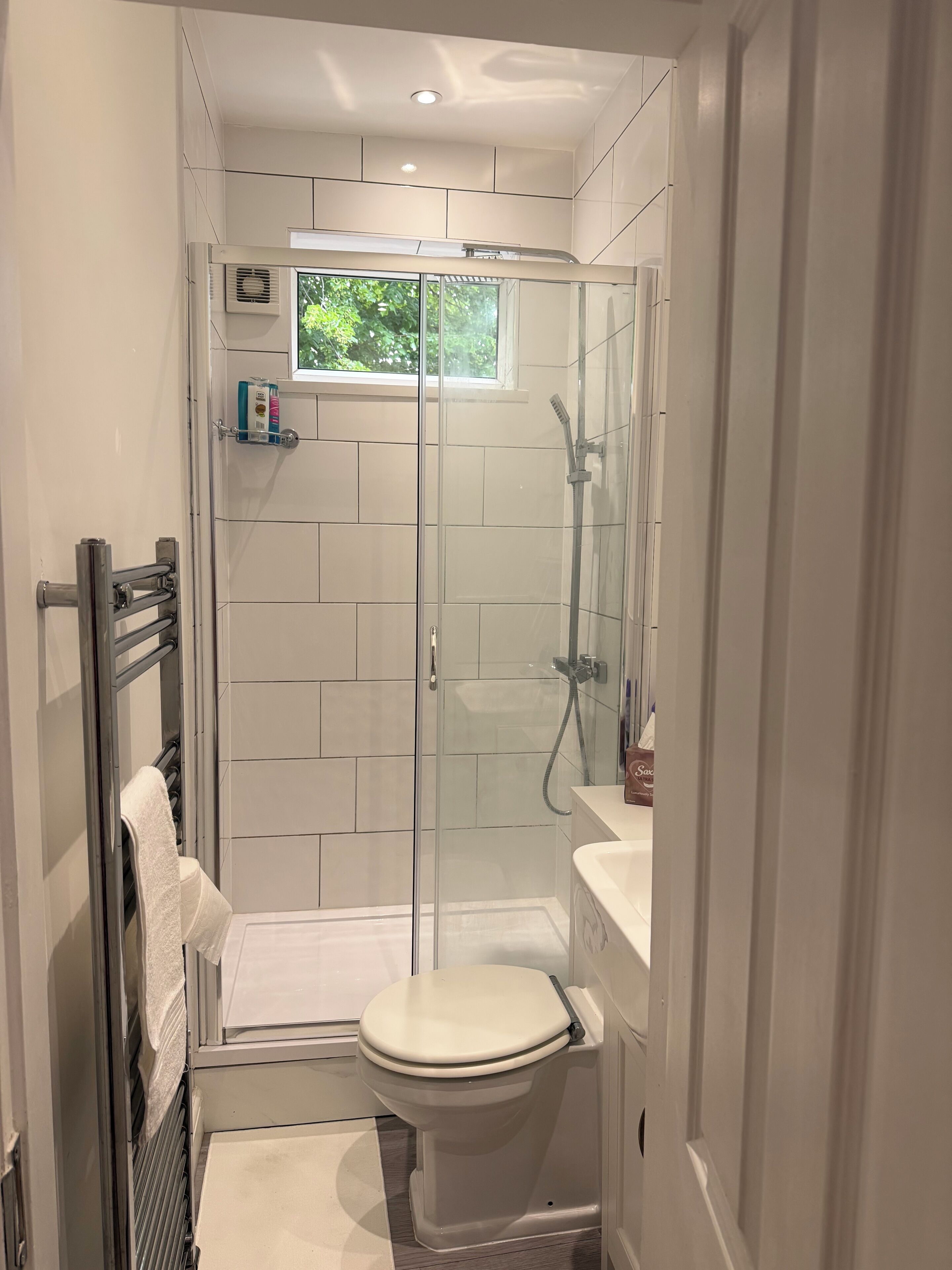 Shower, hair dryer, towels, soap