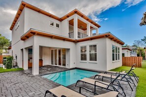A two-story house with a swimming pool, a covered patio, and a fenced backyard. - Private Pool/Free Bikes! 0.7 Miles from Beach. (Santa Rosa Beach)
