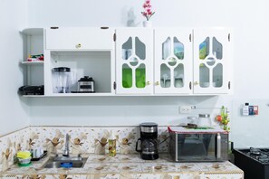 Apartamento, varanda | Cozinha privada