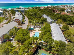 An aerial view of a residential area with a swimming pool, tennis court, and beachfront views. - Updated! Beach Access - Pool - Walkable Dining (Santa Rosa Beach)