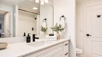 Shower, hair dryer, towels, shampoo