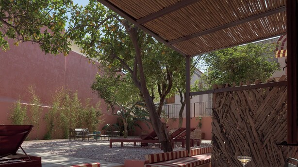 An outdoor patio with seating, a table, and a pergola. - Superior One Bedroom Suite with Patio, Spartacus Garden (Rethymno)