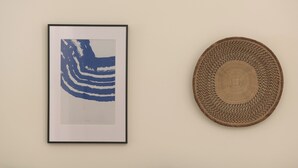 A framed abstract artwork and a woven basket on a wall. - Superior One Bedroom Suite with Patio, Spartacus Garden (Rethymno)