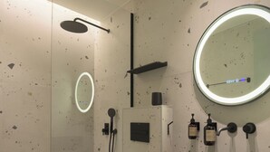 A modern bathroom with a large basin, a round mirror, and a shower area. - Superior One Bedroom Suite with Patio, Spartacus Garden (Rethymno)