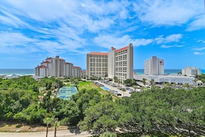 A hotel complex with multiple buildings, a parking lot, and a tennis court. - 🌴Summit at Tops'l 612 | Large Balcony with Gulf Views | Pool | Walk to Beach🌞 (Miramar Beach)