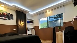 A bedroom with a bed, a desk, a chair, and a window with a view of greenery. - GTA SANDREAS 402 (Medellín)