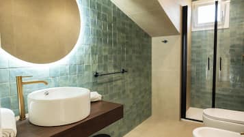 Shower, hair dryer, slippers, towels