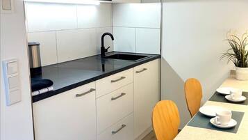 Fridge, microwave, stovetop, coffee/tea maker