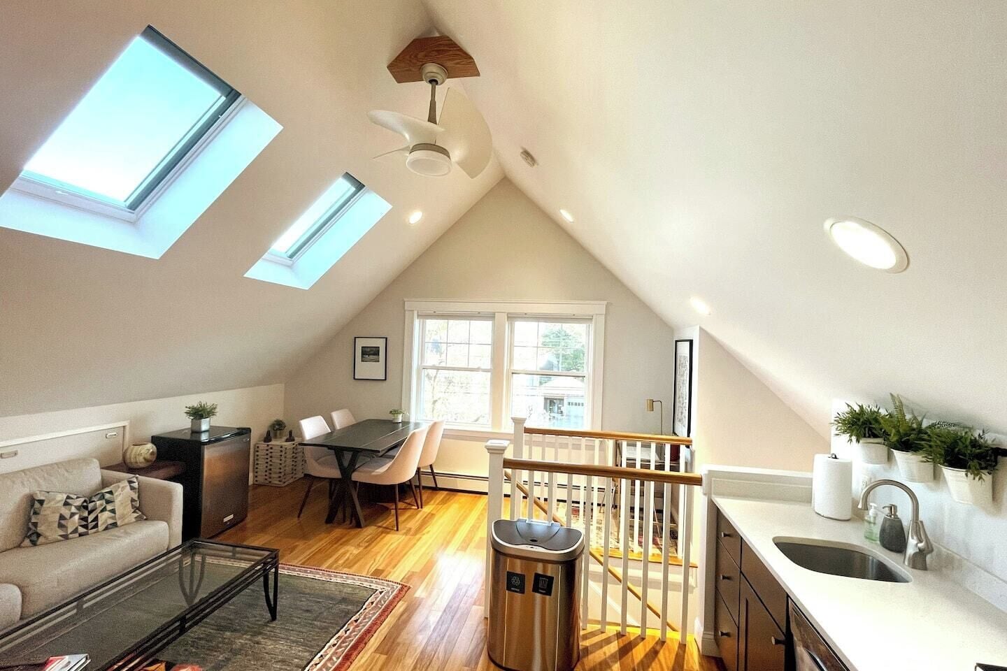  The spacious living area has high ceiling and is full of natural light.