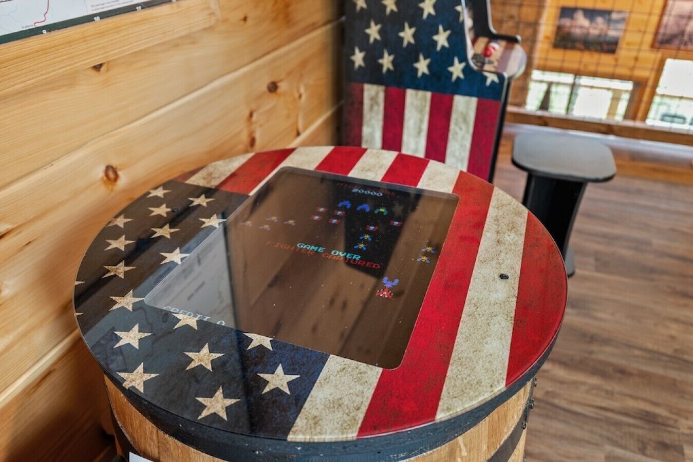 A round table with a glass top and an American flag design.