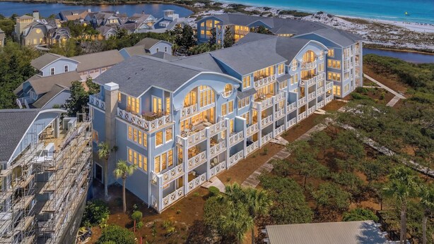 A large resort with multiple buildings, a beach, and a lake. - Gulf View Condo with Community Amenities (Watersound)