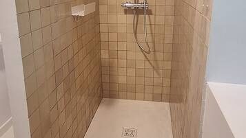Shower, towels, soap, toilet paper