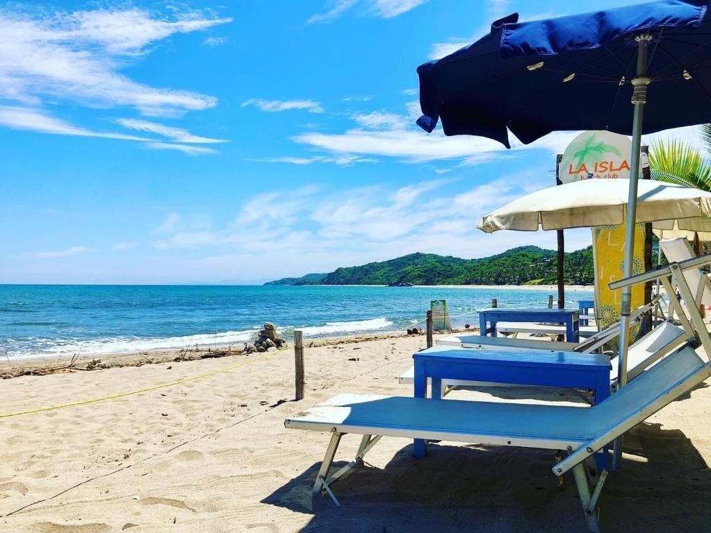 On the beach, sun loungers, beach umbrellas, beach towels