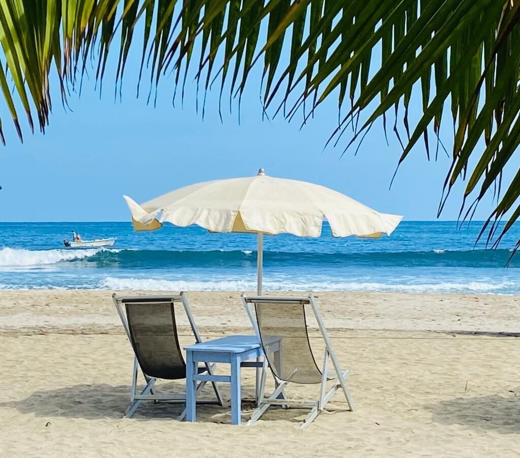 On the beach, sun loungers, beach umbrellas, beach towels