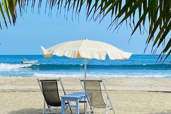 On the beach, sun loungers, beach umbrellas, beach towels
