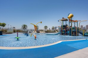 A water play area with slides and a pool. - Free Housekeeping Visits During Your Stay - Stayshort - Stunning Studio in JVT Sleeps 2 With Balcony (Dubai)